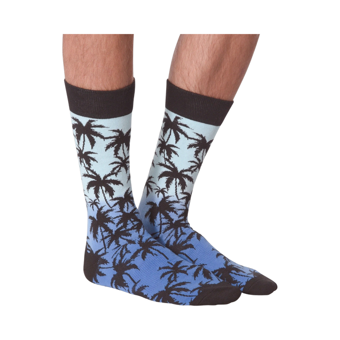 Front view of Palm Socks on a person's legs against a black background.