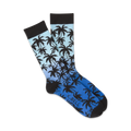 Pair of crew socks with a blue and black ombre gradient and silhouette palm tree design.