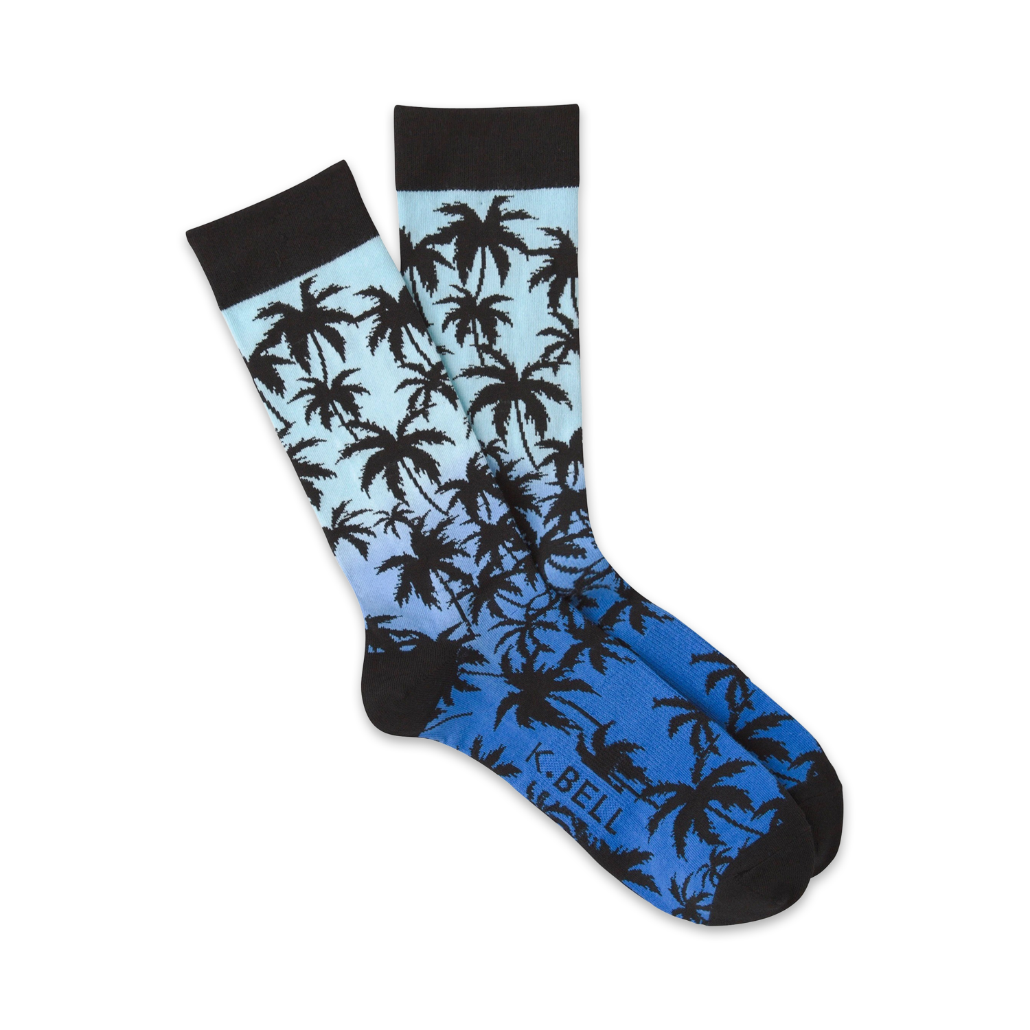 Pair of crew socks with a blue and black ombre gradient and silhouette palm tree design.
