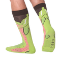 Lifestyle shot showing the Leg Eater Trout socks on a person's legs.