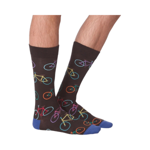 Lifestyle shot of male model wearing the Bright Bikes socks, showcasing how they look when worn.