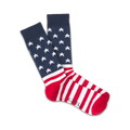 Pair of crew socks in red, white, and navy blue.  The socks feature a design of white stars on navy blue at the top and red and white stripes at the bottom, reminiscent of the American flag.