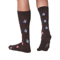 Lifestyle shot: Men's legs wearing dark brown crew socks with red and blue electric guitars.  Socks are shown from the front and back.