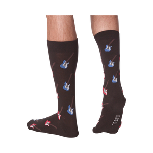 Lifestyle shot: Men's legs wearing dark brown crew socks with red and blue electric guitars.  Socks are shown from the front and back.