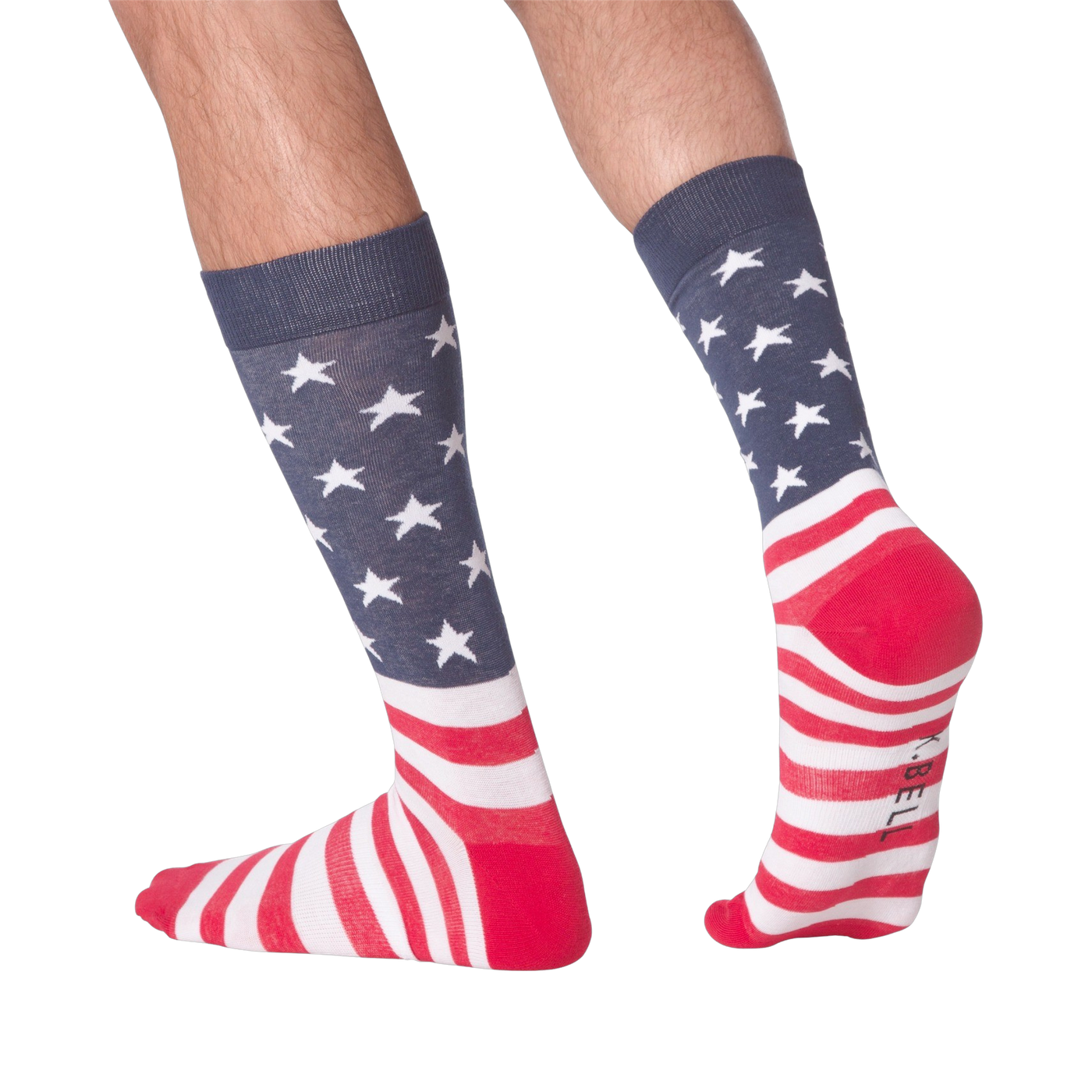 Man's legs wearing American Flag XL socks, showcasing the back and side view against a black background.