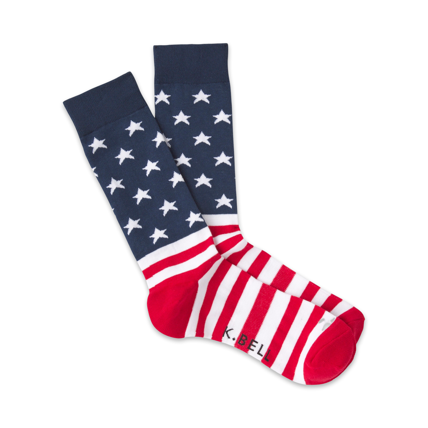 Pair of red, white, and blue crew socks. The top features a navy blue background with white stars; the bottom has red and white stripes. 'K.Bell' is subtly visible on the heel.