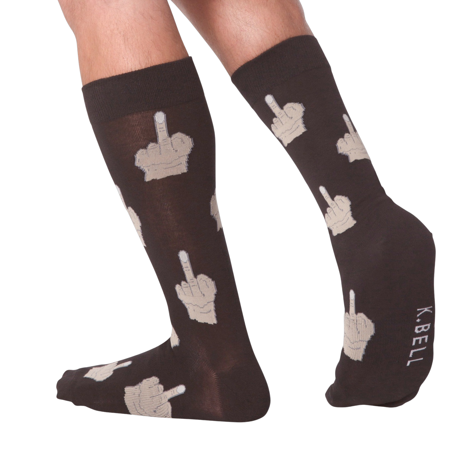 Lifestyle shot: Person's legs wearing dark brown crew socks with beige middle finger design.  K.BELL logo is visible.