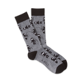 Pair of gray crew socks with a repeating pattern of black cartoon ninjas.  Ninjas are depicted in various playful poses.