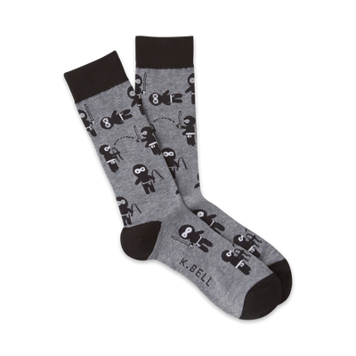 gray crew socks with a pattern of black ninjas in various poses, throwing stars, swinging swords, and jumping.  