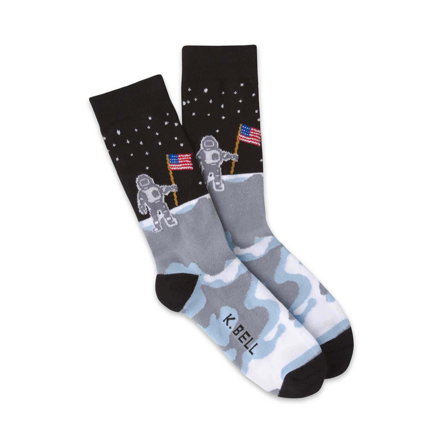 Pair of crew socks in black, gray, and white. The design features astronauts planting American flags on the moon.