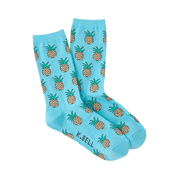 Pair of light blue crew socks with a repeating pattern of brown and green zig-zag pineapples.