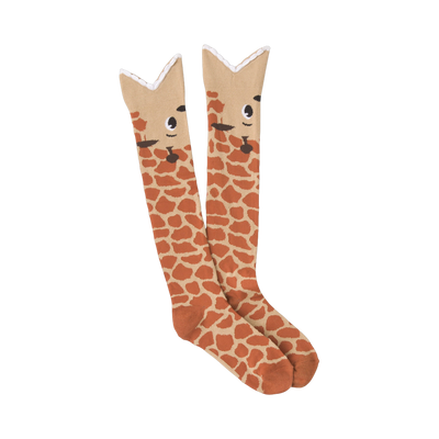 Pair of knee-high socks.  Tan and reddish-brown giraffe print.  Cute giraffe faces are visible at the top of each sock.
