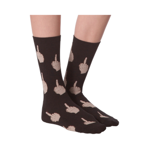 Close-up of a model's legs wearing pink 'Middle Finger' socks.