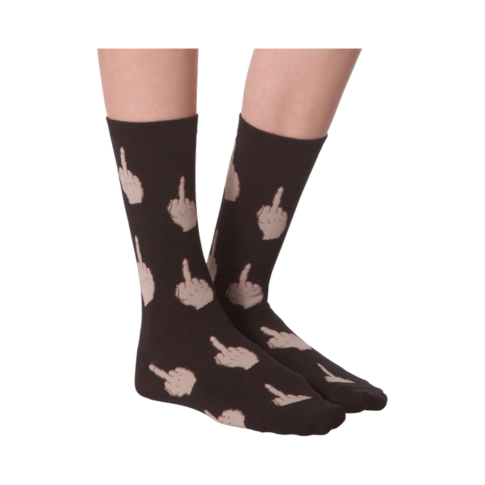 Close-up of a model's legs wearing pink 'Middle Finger' socks.