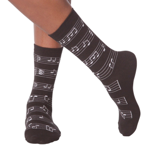 A pair of brown socks with a musical notes pattern.