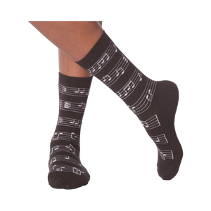 Flat lay image of a pair of white musical note socks.