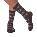 Flat lay image of a pair of white musical note socks.