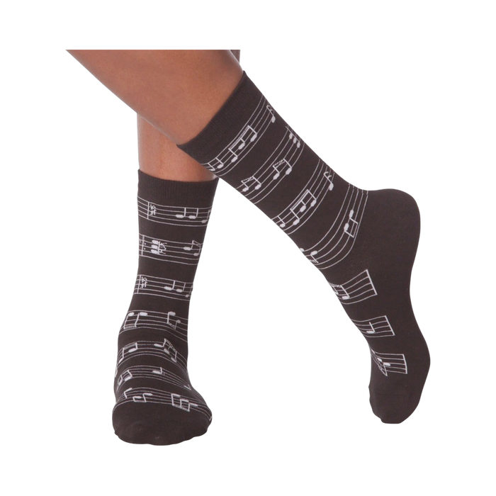 Flat lay image of a pair of white musical note socks.