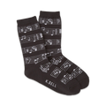 Pair of crew socks in dark grey and white with a musical notes design.  The socks show a repeating pattern of musical notes on a staff.