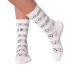 Close up of a person's legs wearing white musical note socks.