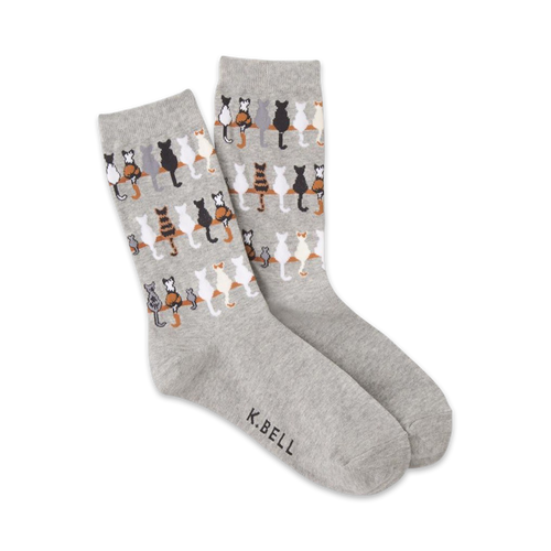Pair of grey crew socks featuring a repeating pattern of cats sitting on a fence. 
