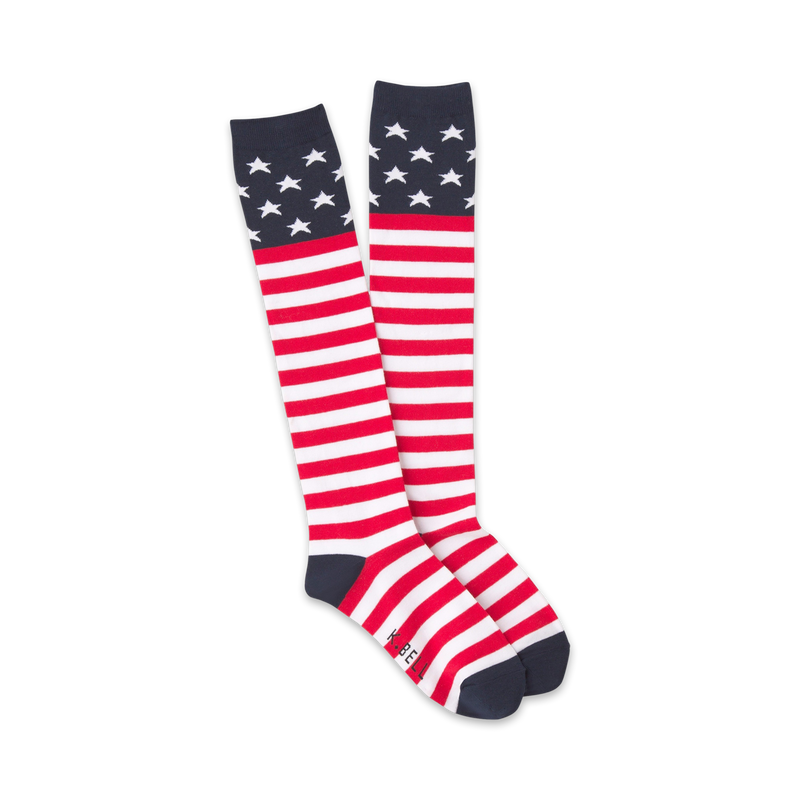 Pair of red, white, and blue knee-high socks with an American flag design.  Stars at the top, stripes on the lower leg.
