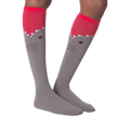 Another lifestyle shot of the shark knee-high socks on a model's legs.