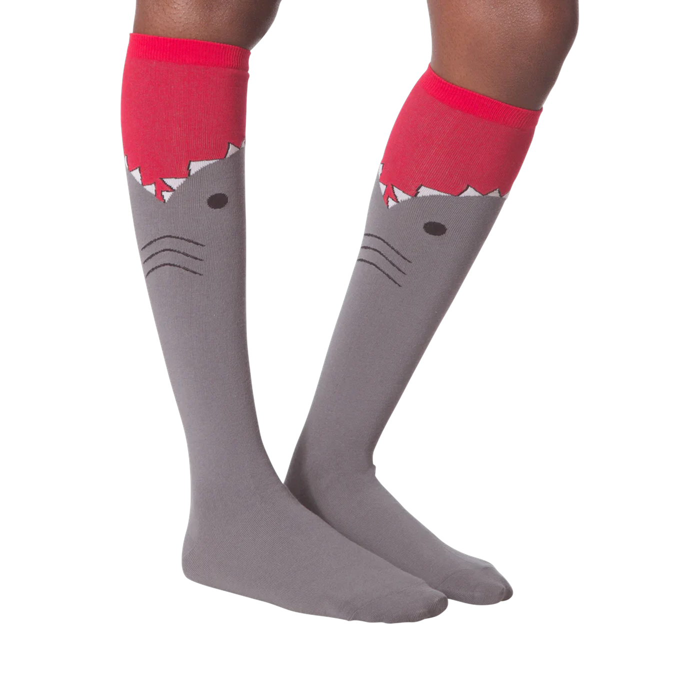 Another lifestyle shot of the shark knee-high socks on a model's legs.