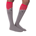 Another lifestyle shot of the shark knee-high socks on a model's legs.