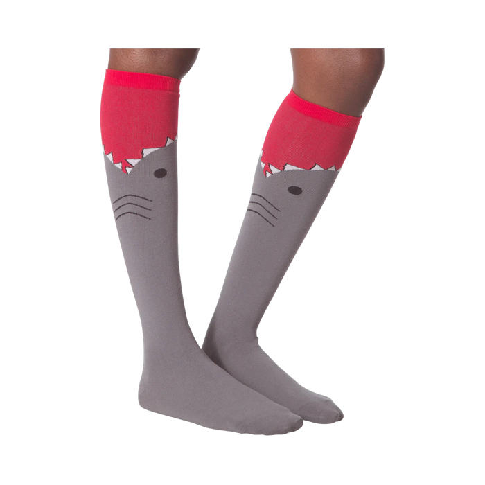 Another lifestyle shot of the shark knee-high socks on a model's legs.