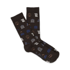 Dark brown crew socks with a fun pattern of law-themed icons: scales of justice, gavels, briefcases, and buildings in blue and beige.