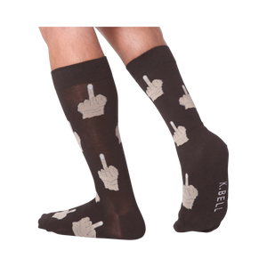 Lifestyle shot showing the Middle Finger socks on a person's legs, showcasing how the socks look when worn.