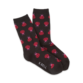 black crew socks with a pattern of red ladybugs with pink spots.   