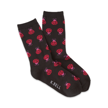 black crew socks with a pattern of red ladybugs with pink spots.   