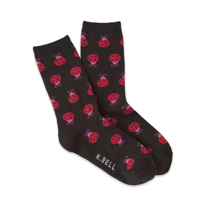black crew socks with a pattern of red ladybugs with pink spots.    }}