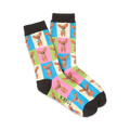 Pair of crew socks with a colorful checkered pattern. Each square features an illustration of a brown Chihuahua. Colors include pink, light green, light blue, and cream.