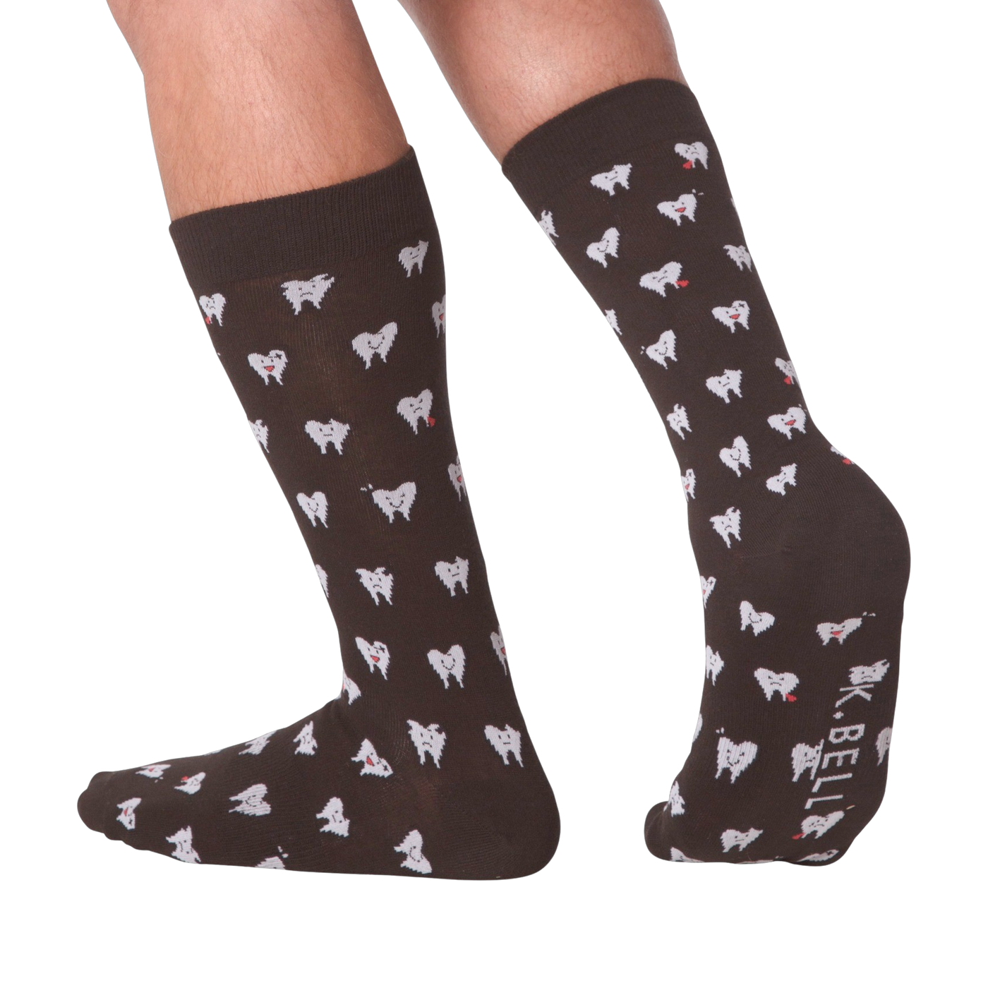 Lifestyle shot showing the socks on a person's feet.  The socks are dark brown with a tooth pattern. The image is on a black background.
