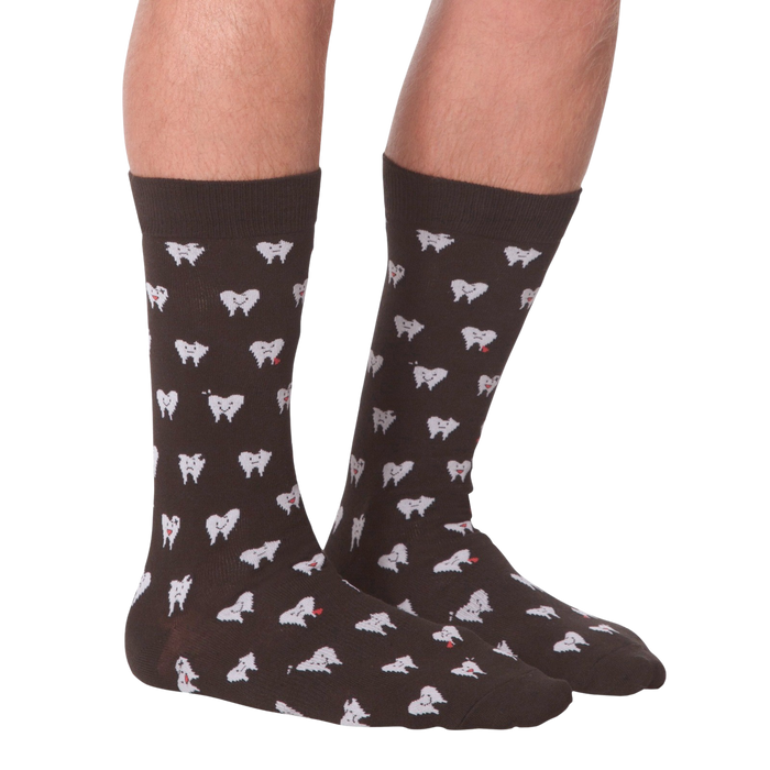 A pair of brown socks with a pattern of white teeth with red hearts on them.