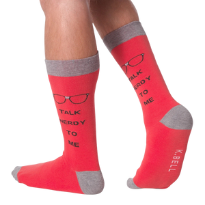 A person is wearing red socks that say 