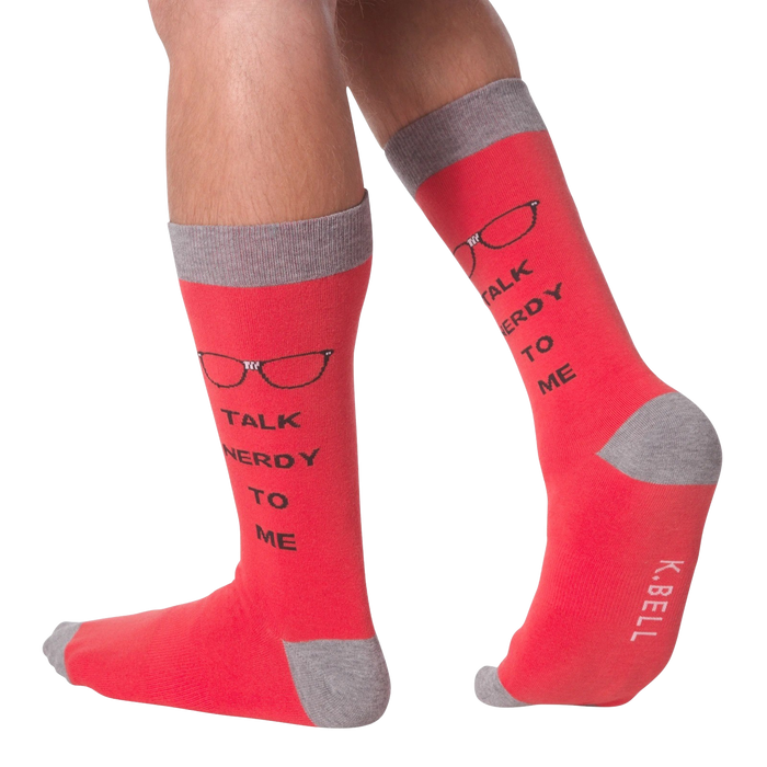 A person is wearing red socks that say 