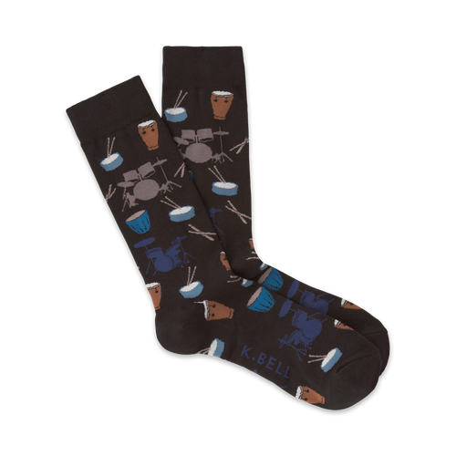 Pair of dark brown crew socks with a pattern of illustrated drums, drumsticks, and cymbals in blue and brown.