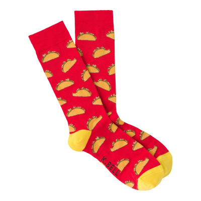 red crew socks featuring a pattern of tacos with lettuce, tomatoes, and cheese on a yellow background, perfect for the taco enthusiast in your life.  