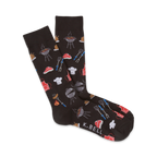 A pair of black crew socks with a fun BBQ design: grills, steaks, chef hats, and grilling tools.
