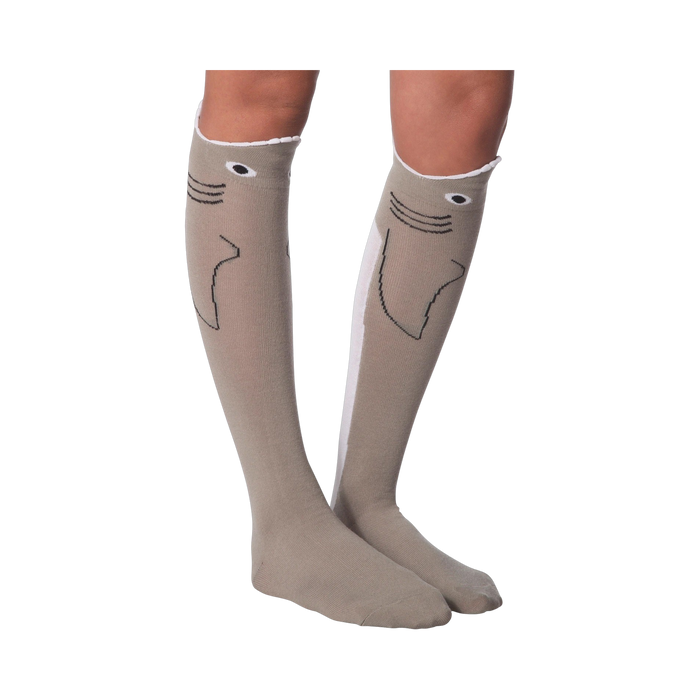 Lifestyle shot: Model's legs crossed, wearing the shark socks. Socks are front and center.