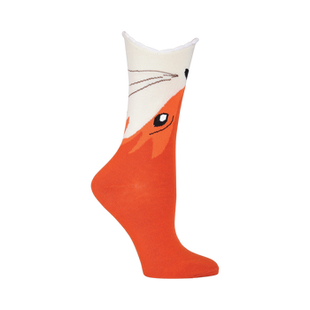 Cream and orange crew socks featuring a whimsical fox face design. The fox's face is on the top of the sock with a scalloped edge.