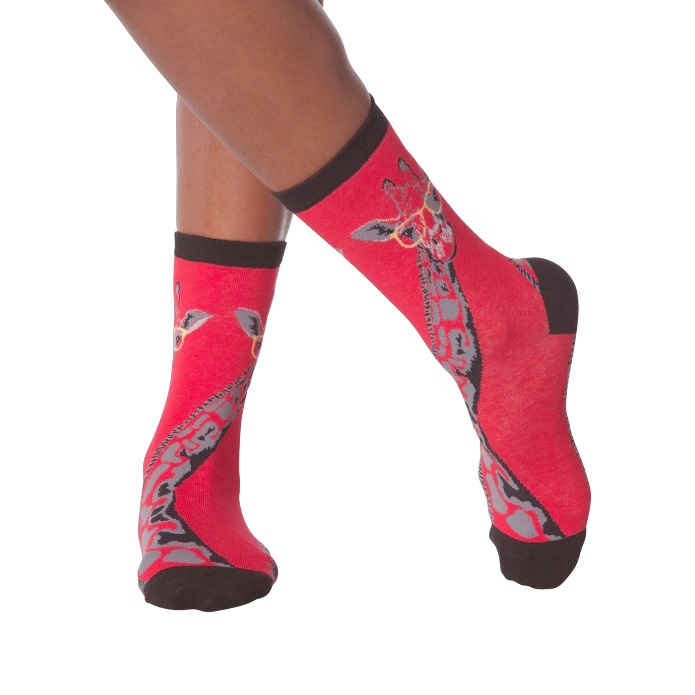 Lifestyle shot of model wearing red crew socks with a giraffe wearing glasses design.