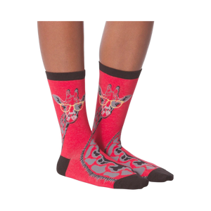 Another lifestyle shot of model wearing red crew socks with a giraffe wearing glasses design.