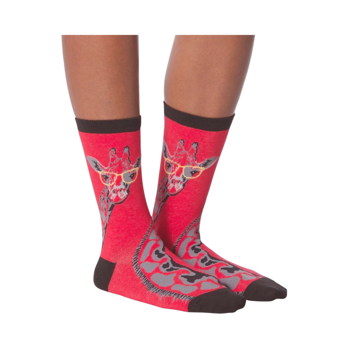 Another lifestyle shot of model wearing red crew socks with a giraffe wearing glasses design.