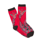 Pair of red crew socks with a whimsical giraffe wearing glasses design. Gray giraffe spots and black cuffs.