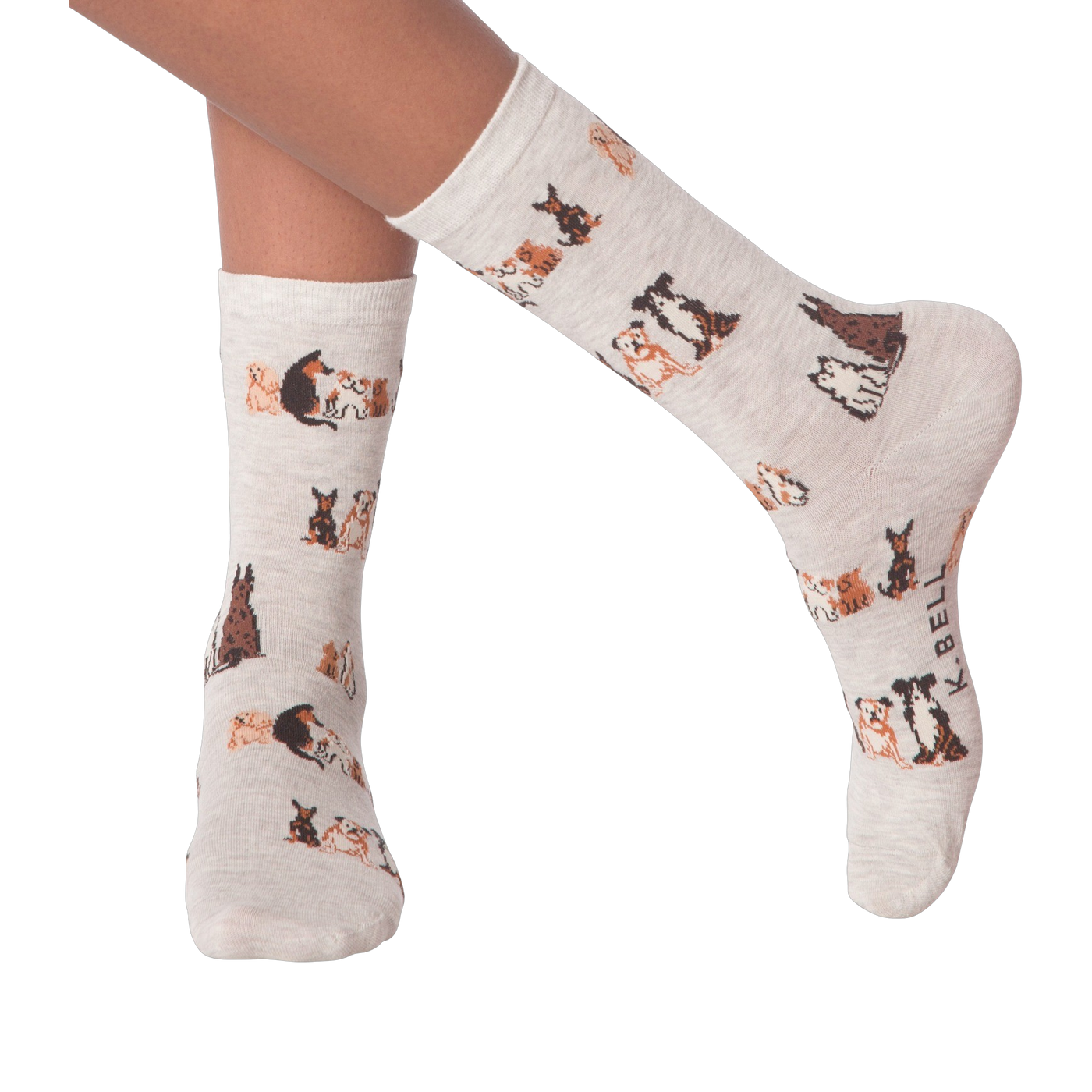 Lifestyle shot of woman's legs wearing the grey crew socks with the dog pattern.